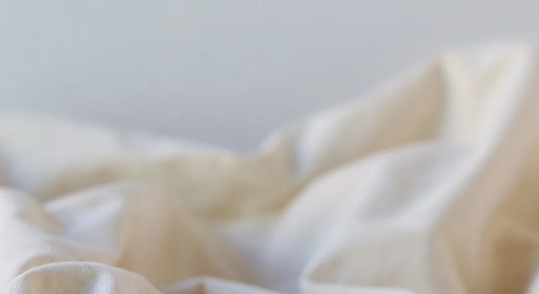 Close-up of soft white blanket fabric