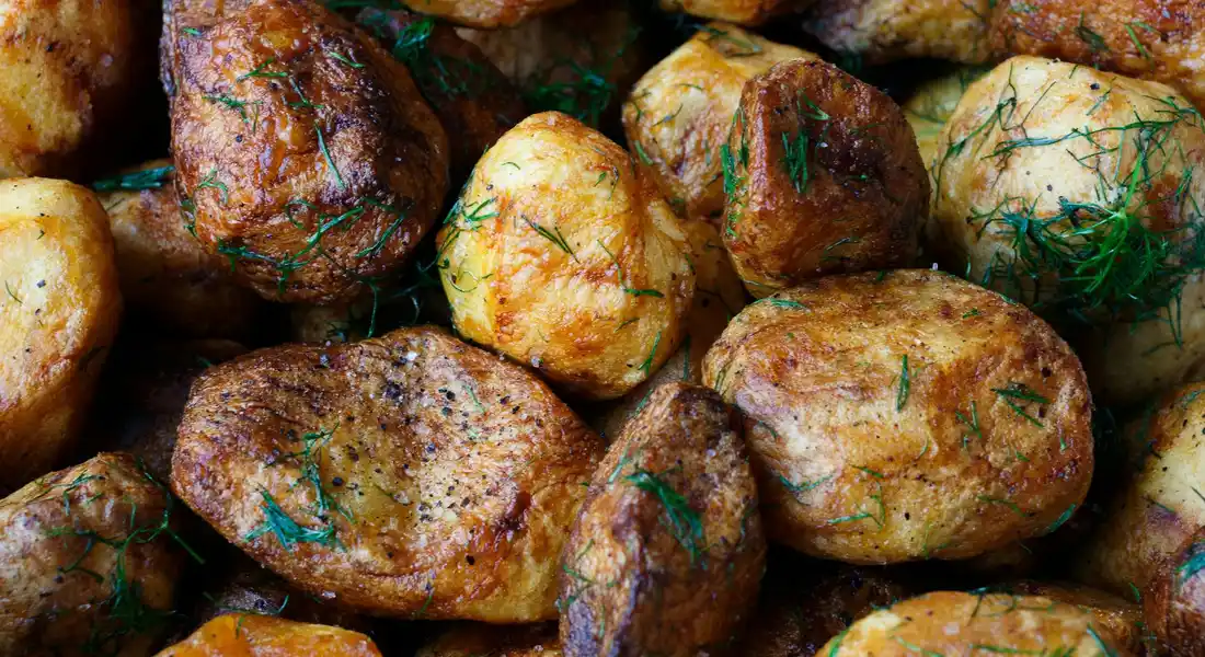 Close-up of potatoes sprinkled with fresh dill